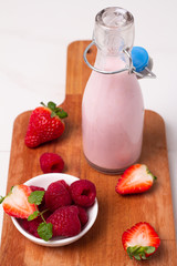bottle with yogurt and fresh berries
