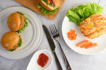 Appetizers with hamburgers and sausage bread roll
