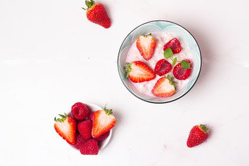 oatmeal with yogurt and fresh berries in a plate