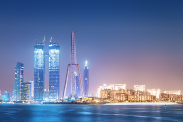 Obraz premium Blue waters island at night with famous Dubai Ferris wheel at night