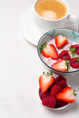 coffee, porridge and berries and place for text