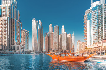 Panoramic view of dubai marina port and tall skyscrapers. Tourist destinations and real estate concept
