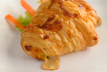 Appetizers the Croissant with hotdog on white dish