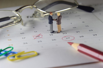 Simple Photo Illustration, Handshaking Mini Figure Businessman, Agree to doing something together...