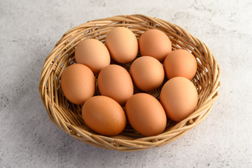 many brown eggs several in a wicker basket