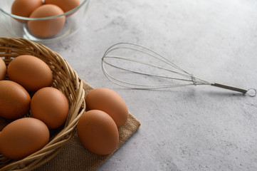 many brown eggs several in a wicker basket