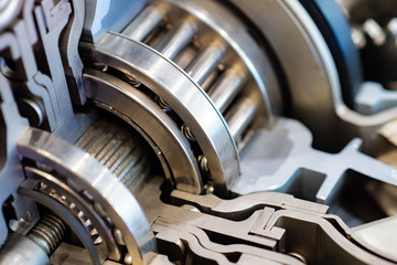 Industrial topics. Fragment of an internal combustion engine. Motor vehicle in the context. Metal...