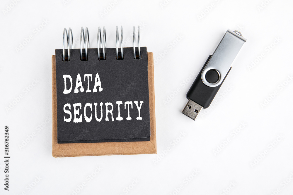 Wall mural data security. usb memory stick on white background