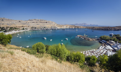 Obraz premium Vliha Bay and Beach of Lindos, overview of from the Acropolis. Lindos, Rhodes, Greece