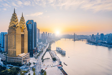Dusk view of golden high-rise buildings along the Yangtze River in Chongqing, China