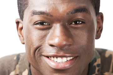 Obraz premium Close-up portrait of happy young man against white background