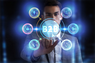 Business, Technology, Internet and network concept. Young businessman working on a virtual screen of the future and sees the inscription: