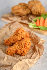 Crispy fried chicken on brown paper, Selective focus.