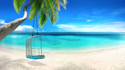 Beautiful tropical beach with white sand, turquoise ocean on  background blue sky with clouds on...