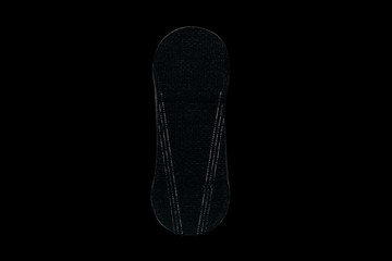 Women black Sanitary pad on black background