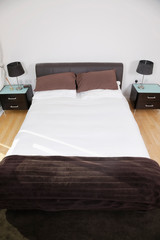 Bed and night tables in bedroom