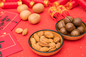 New Year's products of various nuts on the red background of Chinese New Year