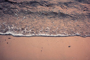 waves of the sea with beautiful air bubbles foam