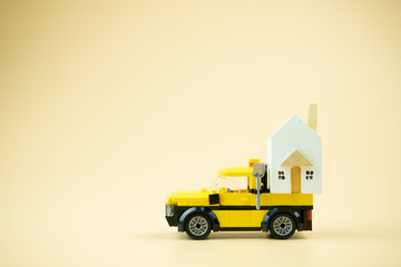 House on toy truck. Moving to new house concept.