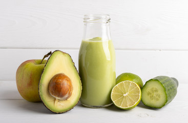 Homemade smoothie with the following detox ingredients avocado, cucumber, apple and lemon.
