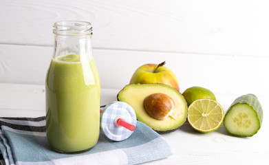 Homemade smoothie with the following detox ingredients avocado, cucumber, apple and lemon.
