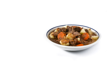 Irish beef stew with carrots and potatoes isolated on white background. Copy spacewwwq