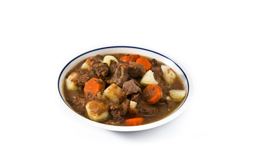 Irish beef stew with carrots and potatoes isolated on white background