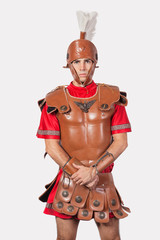 Portrait of an old fashioned soldier against gray background