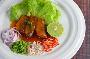 Sardine with tomato sauce and herbs were arranged nicely