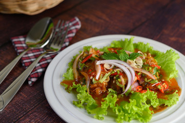 Spicy salad of sardine in tomato sauce mixed with herb