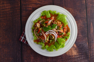 Spicy salad of sardine in tomato sauce inviting hungry