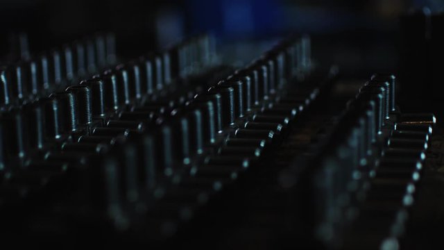 motion along lines of three-way mixing valves on wooden desk