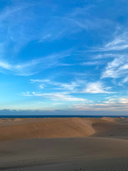 Fototapeta na wymiar Sahara Morocco dunes and desert landscape with beautiful sky and clouds sunset