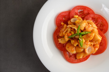 Stir fried macaroni with tomato sauce