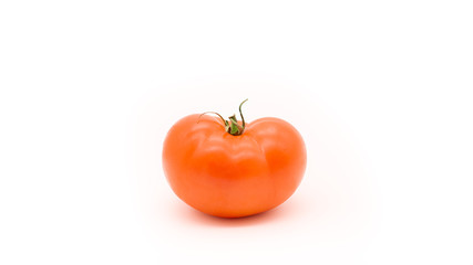 One red tomato isolated on a white background