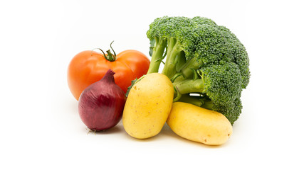 Broccoli, two potatoes, red onion and red tomato on a white background. Isolated