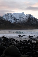 Waves in Unstad beach area which is known as an arctic surfing center located in Lofoten Islands in Northern Norway.  Beach is surrounded by mountains.