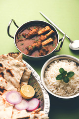 Hyderabadi Mutton Paya, Nehari, nazari or Nihari Masala. served with Naan and rice. selective focus