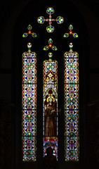 Colorful stained glass window inside San Juan Bautista Church in Arucas, Gran Canaria. Catholic...