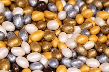 Assorted Gold, Silver, Yellow, Chocolate Eggs, Sweets Or Yummy Candies For Happy Easter. Top View, Selective Focus.