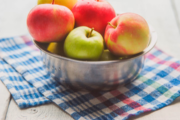 .apple background. On a white wooden table. In a rustic style. Books