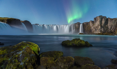 Northern Light at Godafoss waterfall in Iceland