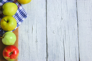 .apple background. On a white wooden table. In a rustic style. Books
