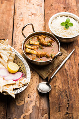 Hyderabadi Mutton Paya, Nehari, nazari or Nihari Masala. served with Naan and rice. selective focus
