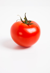 Close-up of tomato over white background