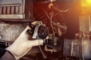 repair electricians ignition coils in a car, high-voltage wires.