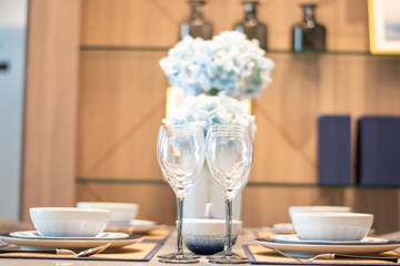 Close-up empty glasses set on a modern dining table.