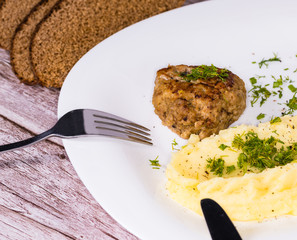 Beef cutlet with mashed potatoes.