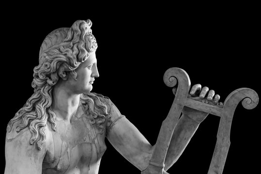 Ancient roman statue of God Apollo playing a lire - black and white photo