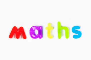 Colorful alphabet magnets spelling 'maths' over white background